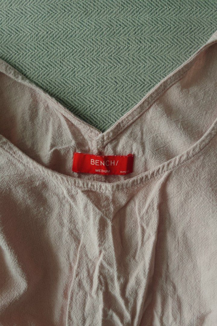 Bench Pink Crop Blouse Size Medium (Category: Blouses) located in Manila. Submitted by designforhumanity (Listing ID 1465621606, Image 3). Description: - Brand: Bench - Size: Medium - Color: Soft Pink - Style: V-neck cropped blouse with wide sleeves and button cuffs - Fit: Sits right at the waist - Condition: Great for casual everyday wear.