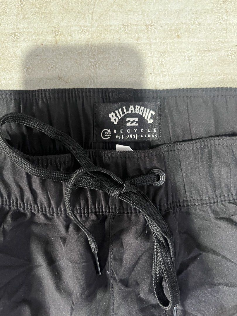 Billabong All Day Layback Board Shorts Black (Category: Swim Trunks & Board Shorts) located in Lapu Lapu. Submitted by vanzfinds_16 (Listing ID 1465689003, Image 2). Description: - Brand: Billabong - Model: All Day Layback Board Shorts - Color: Solid Black - Waistband: Elastic with matching black drawstring - Details: Small white wave logo patch on lower left leg - Material: Eco-friendly recycled fabric (Recycle All Day Layback) - Perfect for: Be