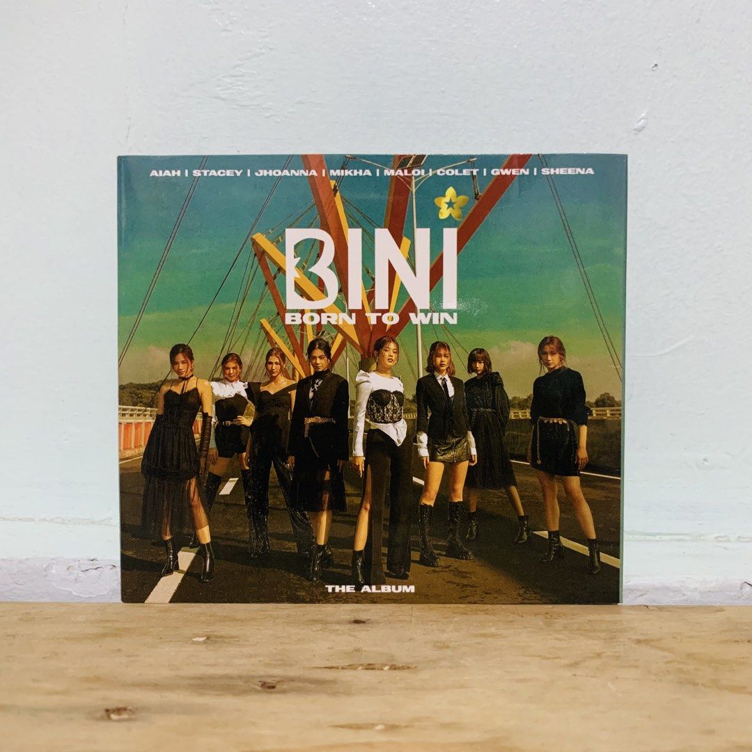 BINI Born To Win The Album CD (Category: CDs & DVDs) located in Caloocan City. Submitted by offthegridfinds (Listing ID 1465756715, Image 1). Description: - Item: BINI Born To Win Debut Album - Tracklist includes: Born To Win, Golden Arrow, Na Na Na, Kinikilig, and Kapit Lang - Includes international versions: Bahasa Indonesia, Japanese, Thai, and Spanish - Condition: Comes with disc and original packaging as pictured - Perfect for Blooms and P-P