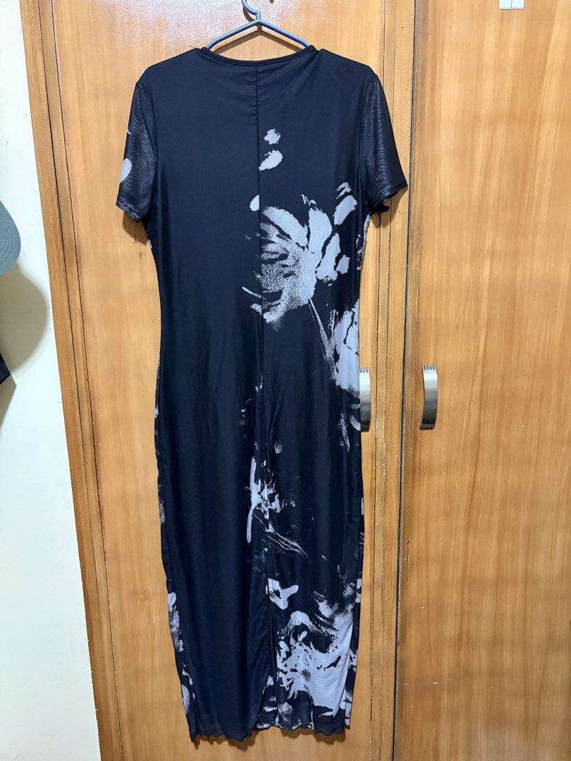 Black and White Floral Mesh Maxi Dress (Category: Dresses) located in Mandaue City. Submitted by klosetfindscebu (Listing ID 1465658024, Image 2). Description: - Style: Black and white abstract brushstroke floral print maxi dress - Design: Short sleeves, round neckline, and sheer mesh overlay - Fit: Fitted silhouette with stylish lettuce hem details - Length: Full length - Occasion: Ideal statement piece for dinners, parties, or nights out.