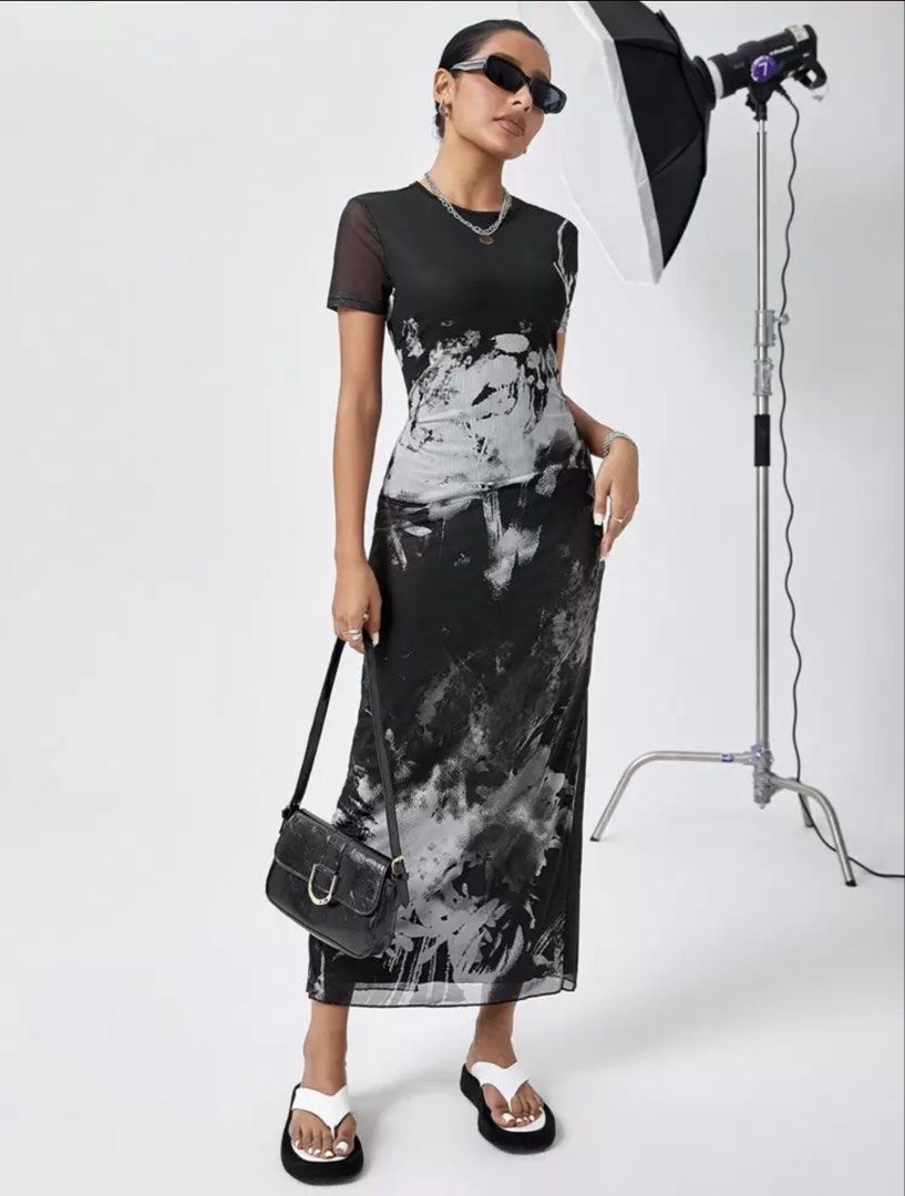 Black and White Floral Mesh Maxi Dress (Category: Dresses) located in Mandaue City. Submitted by klosetfindscebu (Listing ID 1465658024, Image 3). Description: - Style: Black and white abstract brushstroke floral print maxi dress - Design: Short sleeves, round neckline, and sheer mesh overlay - Fit: Fitted silhouette with stylish lettuce hem details - Length: Full length - Occasion: Ideal statement piece for dinners, parties, or nights out.