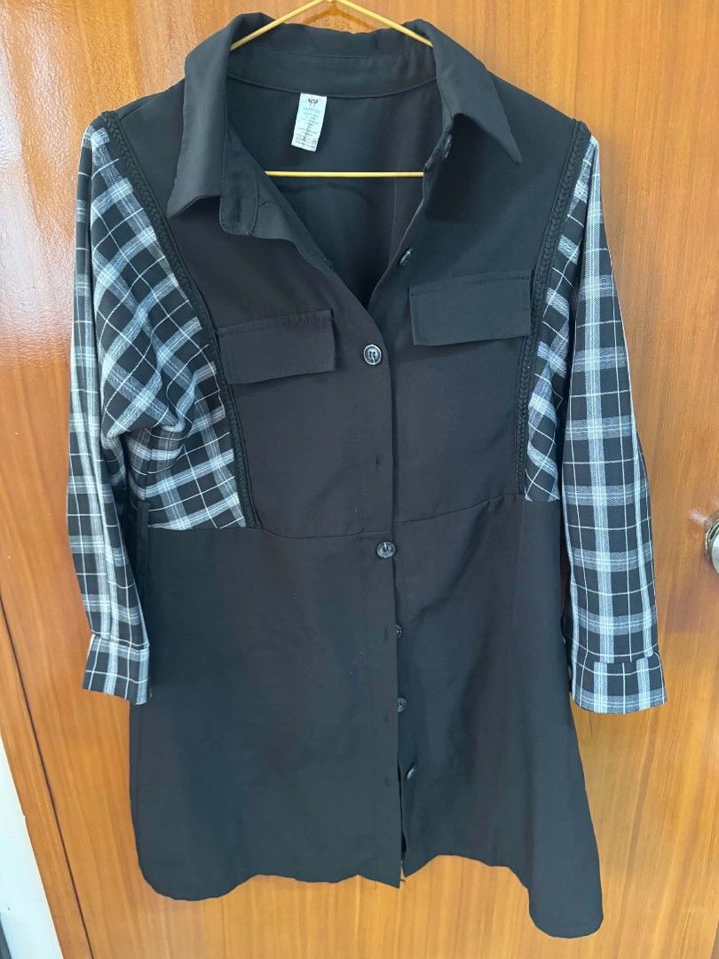 Black and white plaid patchwork button-up shirt (Category: Blouses) located in Caloocan City. Submitted by mylove326 (Listing ID 1465683637, Image 3). Description: - Color: Black with grey and white plaid sleeves and side panels - Material: Comfortable cotton blend - Features: Classic collar, front button closure, and two front chest pockets - Measurements: see photos - Condition: Great piece for a stylish, casual look.