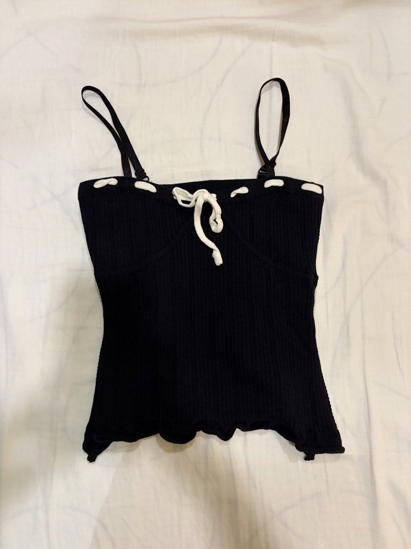 Black and white string knit top (Category: Sleeveless) located in Paranaque City. Submitted by mary_jj (Listing ID 1465672487, Image 1). Description: Size: XS-M (fits 32-36 inch bust). adjustable spaghetti straps .