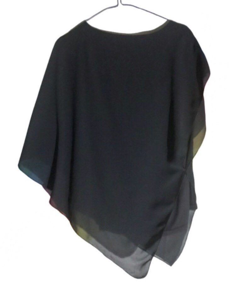BLACK ASYMMETRICAL CHIFFON BLOUSE (Category: Blouses) located in Marikina City. Submitted by minimalistmanila (Listing ID 1465655882, Image 2). Description: Imported new black chiffon asymmetrical blouse with attached inner top. Medium. Pair with skirt or pants. Order now!.
