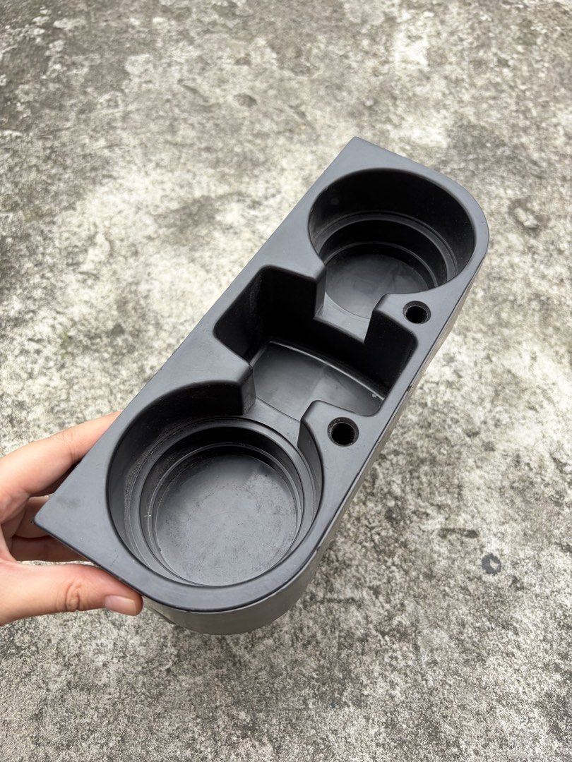 Black Dual Car Cup Holder Center Console Insert Tray (Category: Everything Else Others) located in Manila. Submitted by finderskeepersmnl_092026 (Listing ID 1465700657, Image 2). Description: - Black plastic dual cup holder console insert - Features two circular drink slots and a convenient middle storage compartment - Sturdy build with a sleek matte black finish - Shows minor surface scuffs from previous use, but remains fully functional - Equip