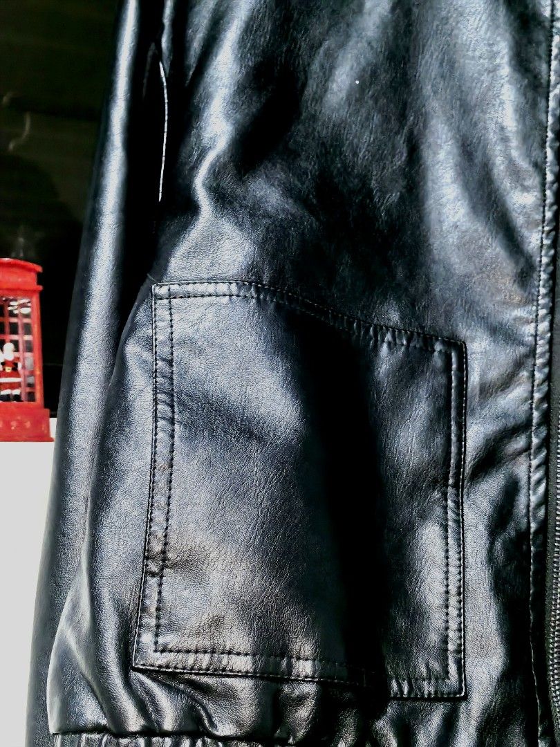 Black Faux Leather Bomber Jacket (Category: Coats, Jackets and Outerwear) located in Manila. Submitted by silentfish.7057b7 (Listing ID 1465744040, Image 2). Description: - Color/Material: Black faux leather - Closure: Front zipper - Fit: Snug ribbed hem and cuffs to keep shape - Pockets: Two roomy front pockets for essentials - Lining: Smooth inner lining for comfort - Best for: Cooler weather outerwear.