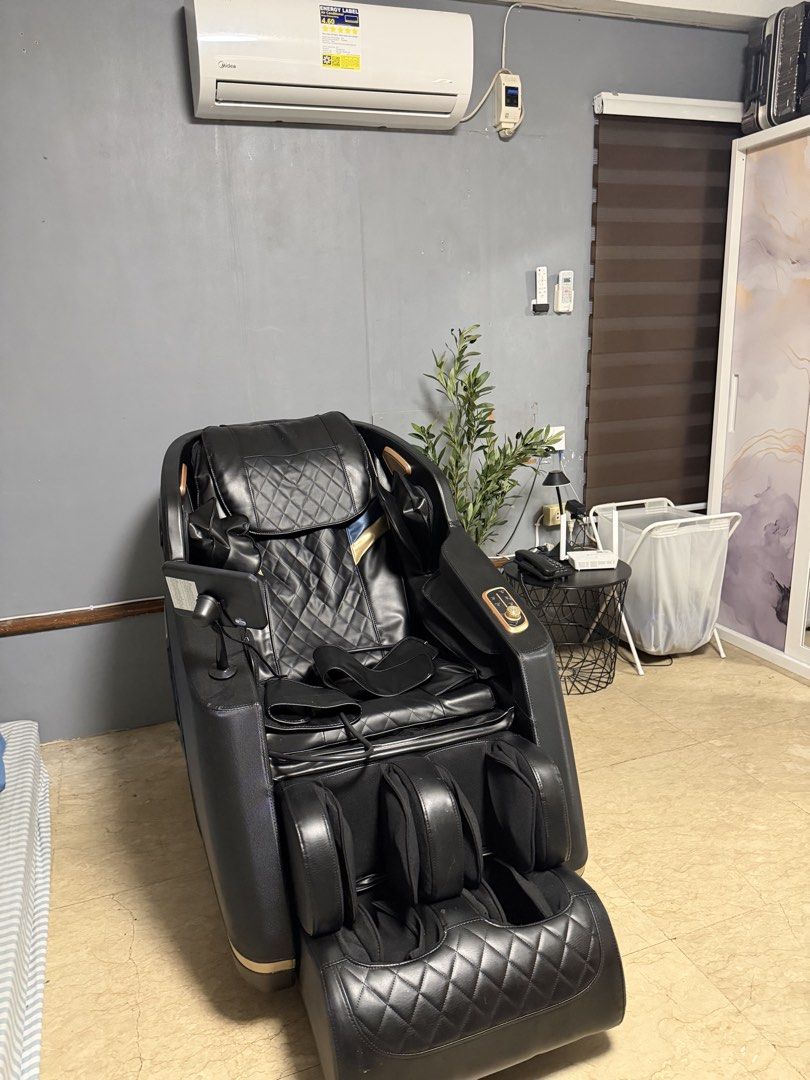 Black Full Body Massage Chair with Touch Screen Controller (Category: Massage Devices) located in Manila. Submitted by shemineforever (Listing ID 1465681896, Image 1). Description: - Premium black leather full body massage chair featuring elegant quilted diamond stitching and gold-toned trim - Built-in control tablet conveniently located on the armrest for easy adjustments - Comprehensive massage features including extra arm/hand massagers and de