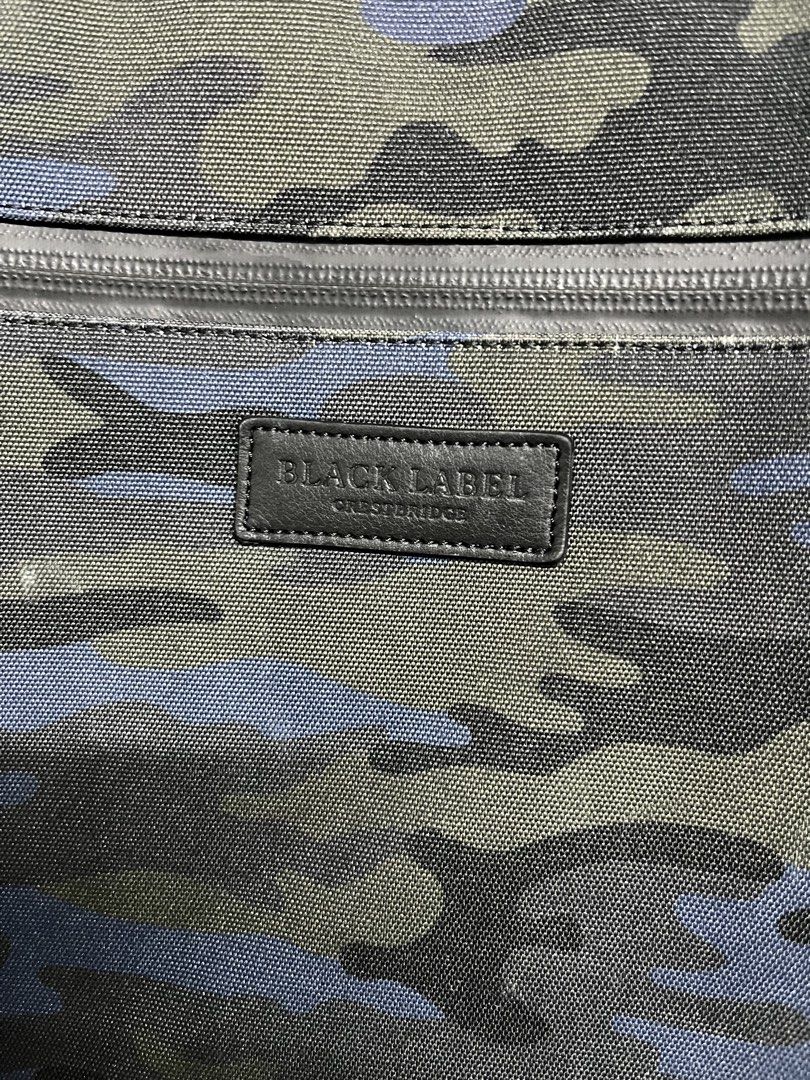 BLACK LABEL CRESTBRIDGE Camo Backpack (Category: Backpacks) located in Valencia. Submitted by shopstnd (Listing ID 1465678420, Image 3). Description: BLACK LABEL CRESTBRIDGE Camo Backpack Blue camo backpack with a clean utility-inspired design, perfect for everyday use and streetwear fits. Condition: 8/10 Color: 9/10 •Blue camo pattern with BLACK LABEL CRESTBRIDGE branding •Multiple zip compartments & pockets Adjustable backpack straps with top c