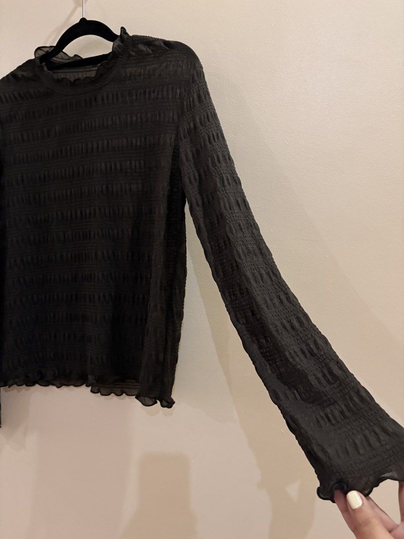Black Ruched Long Sleeve Mock Neck Top (Category: Longsleeves) located in Manila. Submitted by anabri (Listing ID 1465712064, Image 2). Description: - Color: Black - Style: Slim fit, mock neckline with lettuce edges - Material: Sheer lightweight mesh with all-over ruching texture - Features: Lettuce edge cuffs, great basic for layering - Fits until size L bec it is stretchy. Last 3 PHOTOS FOR FIT INSPO ONLY!!!.