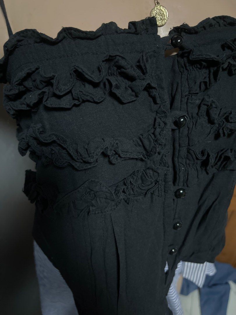 Black Ruffled Coquette Button-Front Tank Top Cami XS-S (Category: Sleeveless) located in Calamba. Submitted by goldenprngs101 (Listing ID 1465720498, Image 3). Description: Ruffled Coquette Cami Top Bring out your inner doll with this gorgeous tiered ruffle cami! Perfect for pairing with your favorite wrap skirts, denim, or balletcore looks. 🖤 🎀 Features & Fit: • Bust: 32” (with stretch) • Length: 12” (measured from top tube down) • Tiered ruff