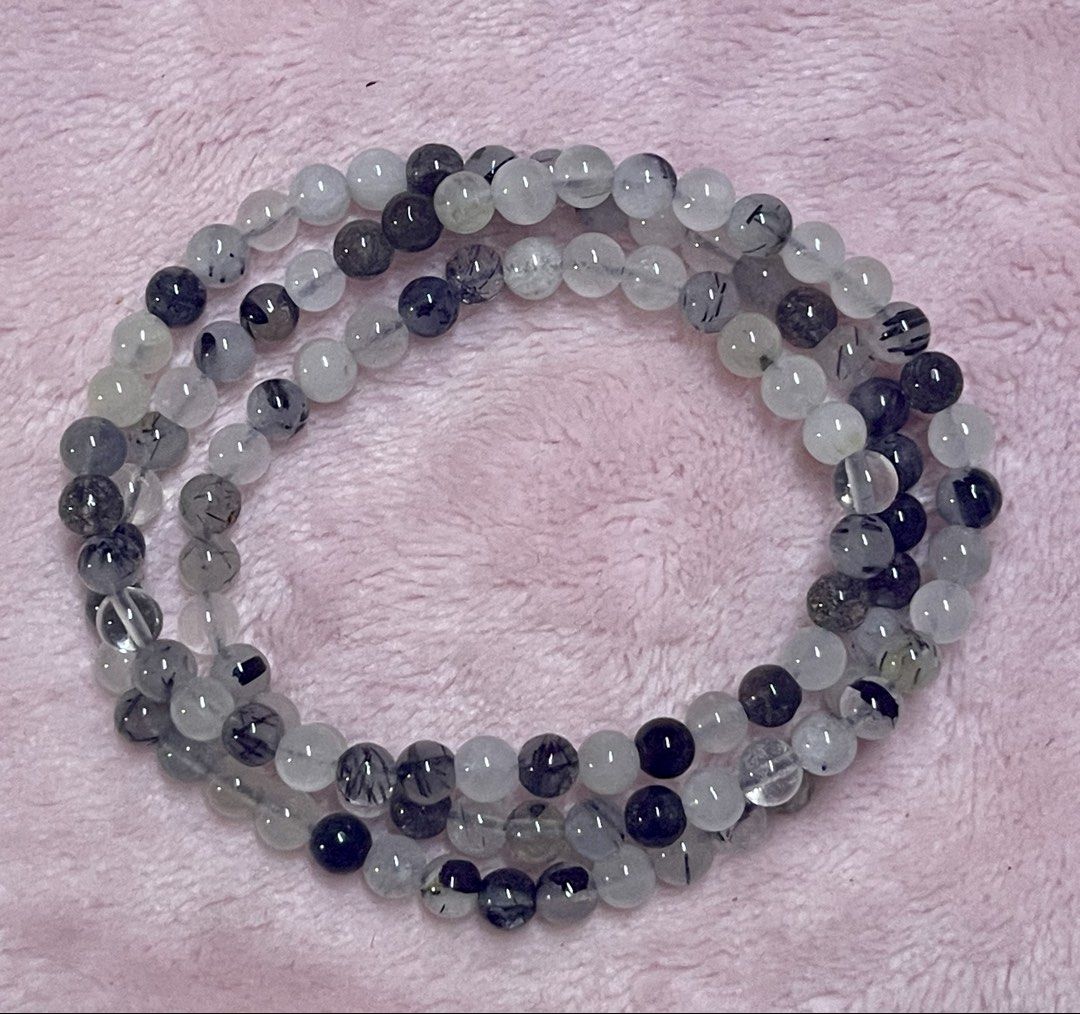 Black Rutilated Quartz 3laps (Category: Bracelets) located in Manila. Submitted by Crystal_Oracle (Listing ID 1465587705, Image 2). Description: Black Rutilated Quartz is a unique crystal that combines clear quartz with fine, needle-like black rutile inclusions. In spiritual and metaphysical traditions, it is valued as both a high-vibration amplifier and a grounding protector. Key Spiritual and Metaphysical Benefits: • Energetic Protection and Sh
