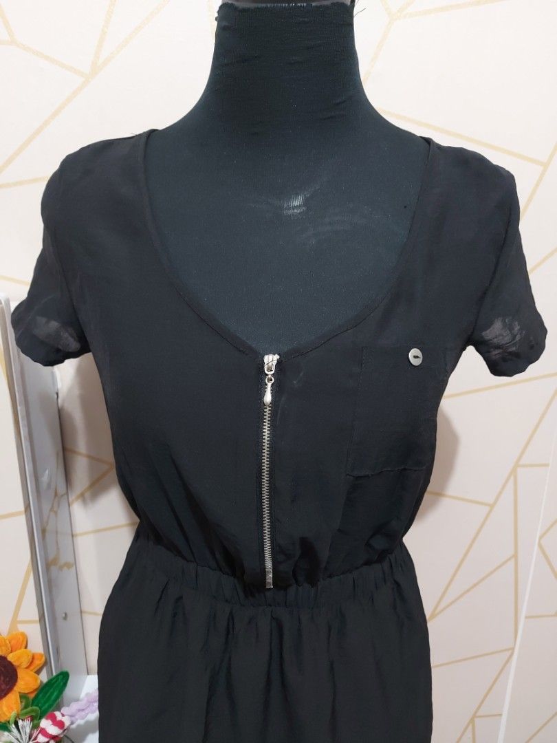Black Short Sleeve Dress Size S (Category: Dresses) located in Manila. Submitted by jollyann_b1990 (Listing ID 1465633029, Image 2). Description: - Brand: Xhilaration - Size: Small - Color: Black - Features: Elastic waist, front zipper detail at neckline, left chest pocket - Fabric: Lightweight and comfortable - Condition: Clean, excellent overall condition - Style: Casual daily wear.