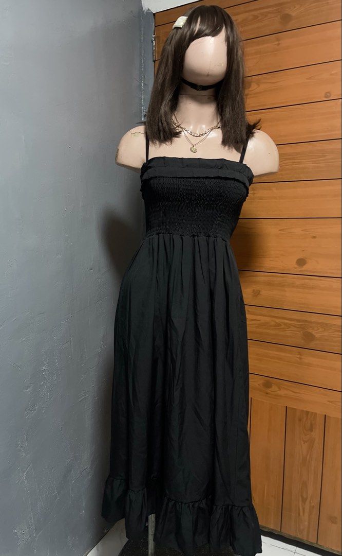 Black Spaghetti Strap Smocked Ruffle Hem Maxi Dress (Category: Dresses) located in Calamba. Submitted by goldenprngs101 (Listing ID 1465690420, Image 1). Description: - Color: Classic Black - Style: Maxi dress with thin straps and square neckline - Fit: Comfortable stretchy smocked bodice - Design: Long flowing skirt with a ruffled hem - Fabric: Lightweight, breezy, and easy to style - Perfect for: Casual days out, brunch, or weekend errands Fit 