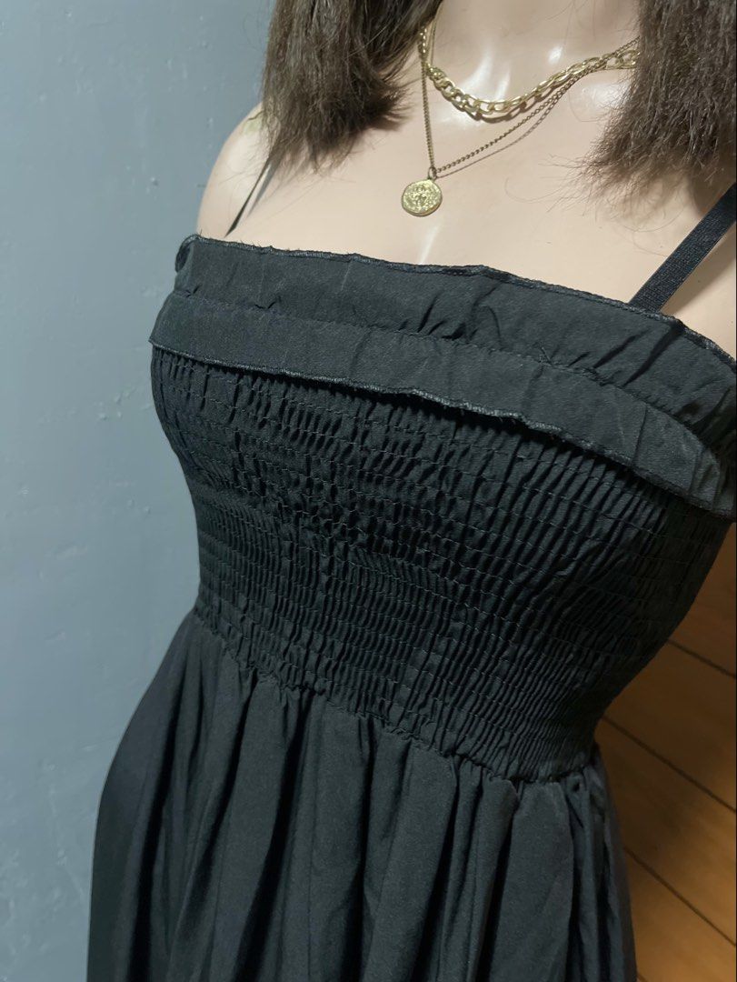 Black Spaghetti Strap Smocked Ruffle Hem Maxi Dress (Category: Dresses) located in Calamba. Submitted by goldenprngs101 (Listing ID 1465690420, Image 2). Description: - Color: Classic Black - Style: Maxi dress with thin straps and square neckline - Fit: Comfortable stretchy smocked bodice - Design: Long flowing skirt with a ruffled hem - Fabric: Lightweight, breezy, and easy to style - Perfect for: Casual days out, brunch, or weekend errands Fit 