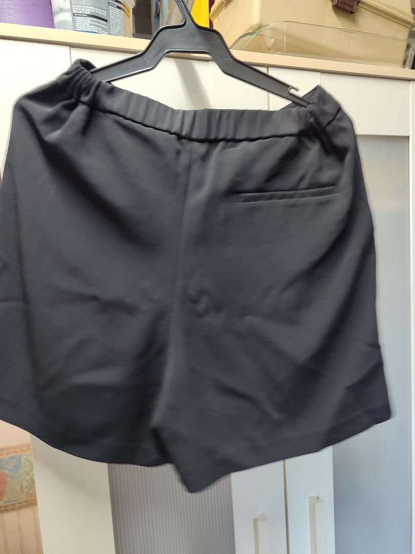 Black Tailored Shorts mid Waist with Pockets (Category: Shorts) located in Mandaluyong City. Submitted by thethrifthaul (Listing ID 1465757338, Image 3). Description: - Color: Classic Black, refer to image for size - Fit: mid to High waist with standard sizing - Comfort: Elastic back waistband for extra ease Rise: 35cm, short opening: 34 cm, short length:42cm - Details: Chic front pleats and clean back pocket design - Fabric: Smooth and premium q