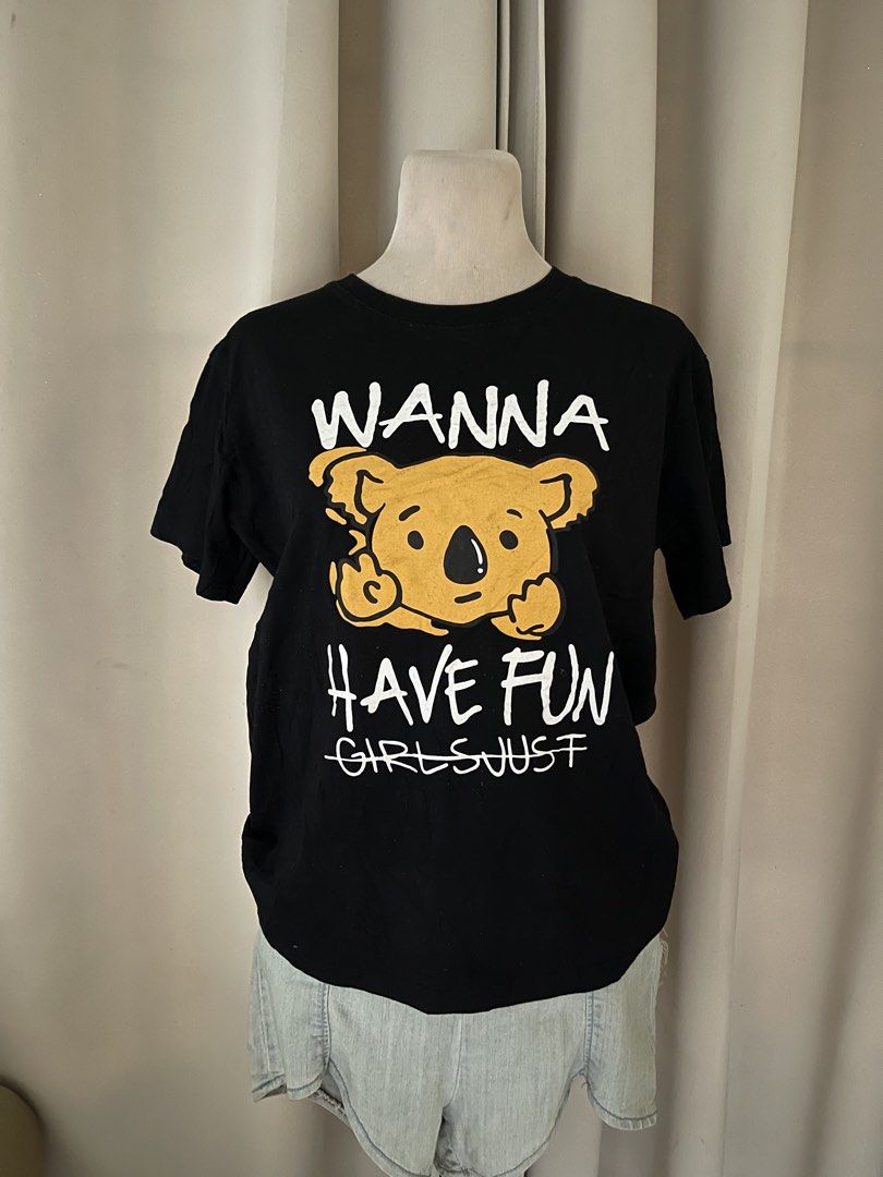 Black T-Shirt with Funny Koala (Category: Shirts) located in Cainta. Submitted by zlove111 (Listing ID 1465758109, Image 1). Description: - Color: Black with bold yellow koala graphic - Design: 'Wanna Have Fun' text with 'Girls Just wanna have fun' crossed out - Material: Comfortable, breathable cotton fabric - Fit: Standard fit for everyday wear - Style: Quirky statement piece, easily paired with denim shorts or jeans - Condition: / Excellent (r