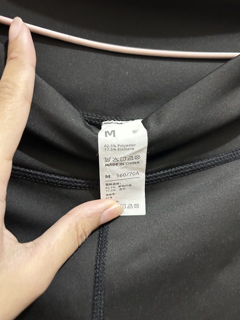 Black Workout Leggings Size M (Category: Activewear) located in Manila. Submitted by frances_001 (Listing ID 1465692188, Image 2). Description: - Color: Solid black - Size: M (160/70A) - Material: 82.5% polyester, 17.5% elastane (super stretchy) - Fit: High-waisted with supportive front stitching - Condition: Brand new with tags intact - Versatile for workouts or daily casual wear.