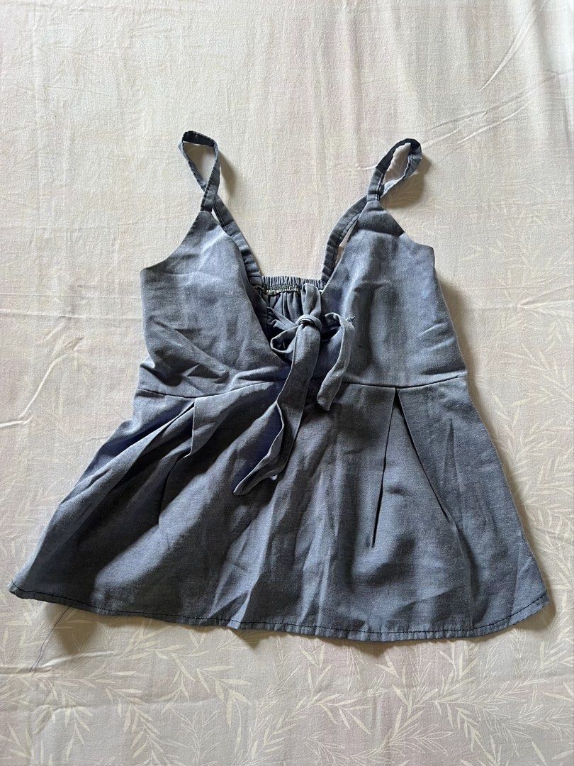 Blue denim cami top with front bow (Category: Sleeveless) located in Quezon City. Submitted by katedeclutter (Listing ID 1465599909, Image 1). Description: - Color: Light blue denim - Size: S.