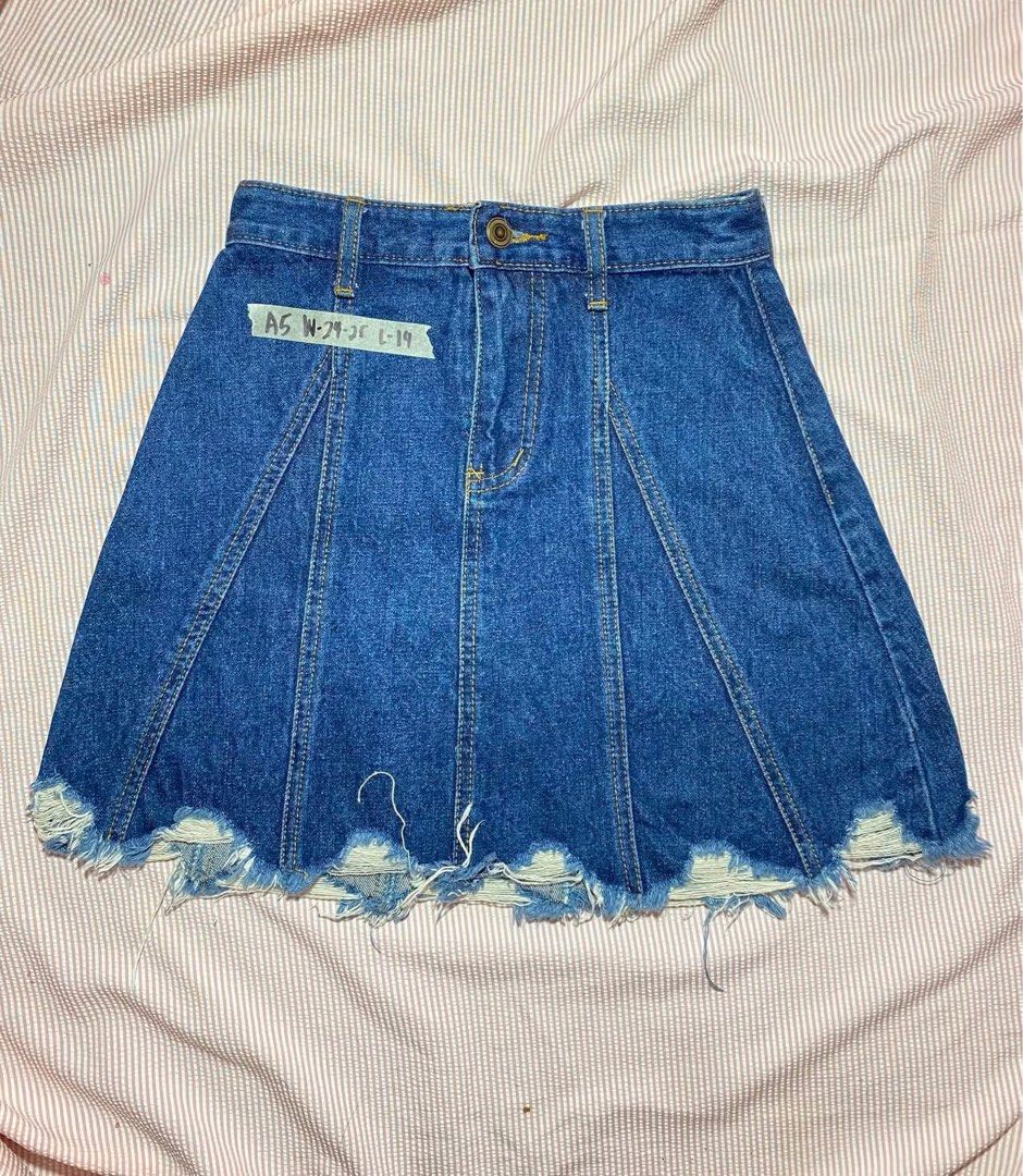 Blue Denim Skirt Distressed Hem Size 24 (Category: Skirts) located in Manila. Submitted by lucky_jinky (Listing ID 1465631396, Image 1). Description: W:24-25 L:14 - Style: Classic skater silhouette with structured vertical panels - Fit: High-waisted with button closure and belt loops - Details: Distressed raw hem and dark wash denim - Label Size: A5 (Waist: 24-25 inches, Length: 19 inches) - Condition: Excellent, ready to wear.