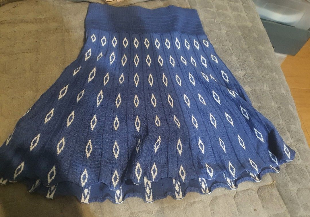 Blue Knitted Skirt with Diamond Pattern (Category: Skirts) located in Manila. Submitted by sabbyy_wabbyy (Listing ID 1465706160, Image 1). Description: - Style: Blue knitted flare skirt with repeating white diamond pattern - Comfort: Easy slip-on with a stretchable elastic waistband - Movement: Beautiful flare cut that swings nicely as you walk - Styling: Great to pair with basic tops for casual everyday wear - Condition: Brand new / Excellent qu