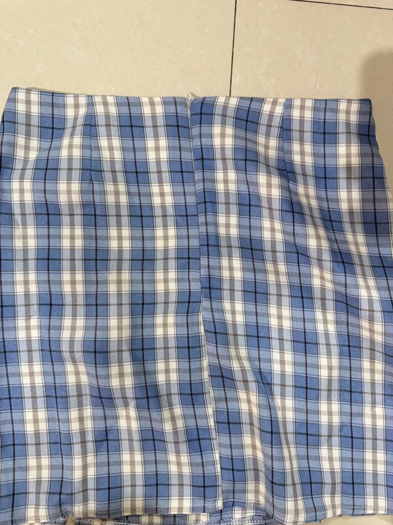 Blue Plaid Mini Skirt (Category: Skirts) located in Quezon City. Submitted by sweetlyluxe (Listing ID 1465602429, Image 2). Description: - Color/Pattern: Blue, white, and grey plaid - Style: High waist, short length mini skirt - Details: Clean hem, pattern matches nicely across front panels - Versatility: Easy to pair with basic tops for casual everyday outfits - Condition: Excellent / Like new - perfect for byeon woo seok fanmeet.