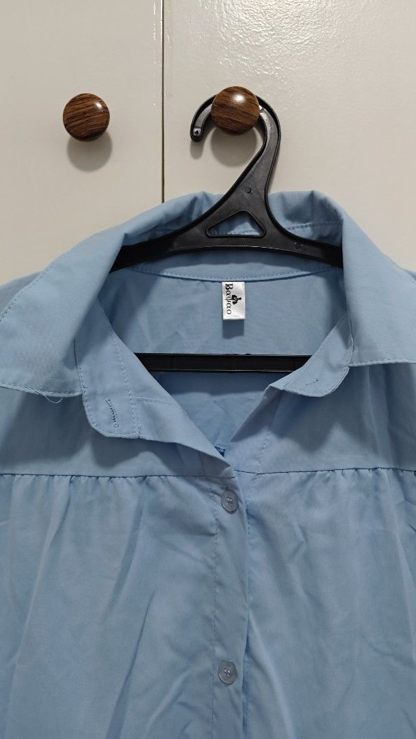 Blue Polo Dress Freesize (Category: Dresses) located in Antipolo. Submitted by tnskbl (Listing ID 1465642557, Image 2). Description: Light blue tiered shirt dress in a lightweight cotton-blend. Features a collared button-down front, short puff sleeves, and a flowy silhouette. Perfect for effortless casual days!.