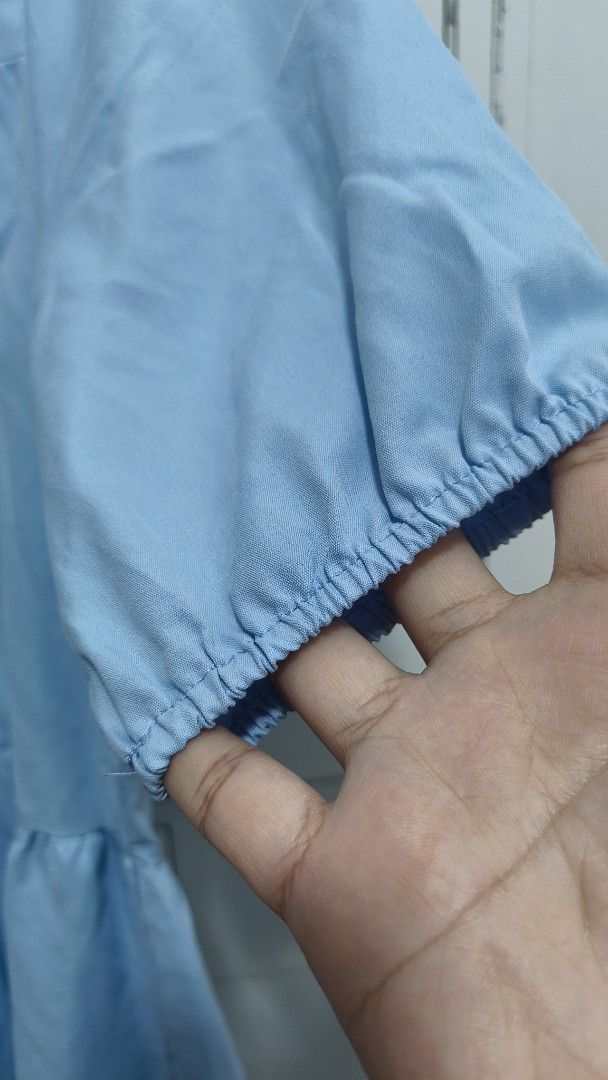 Blue Polo Dress Freesize (Category: Dresses) located in Antipolo. Submitted by tnskbl (Listing ID 1465642557, Image 3). Description: Light blue tiered shirt dress in a lightweight cotton-blend. Features a collared button-down front, short puff sleeves, and a flowy silhouette. Perfect for effortless casual days!.