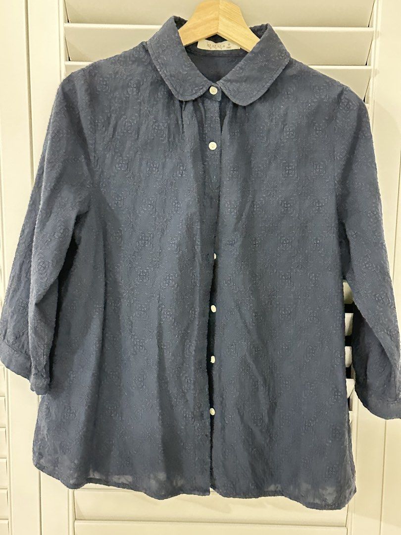 Blue Snowflake Pattern Button-Down Blouse (Category: Blouses) located in Singapore. Submitted by kindermum (Listing ID 1465699877, Image 3). Description: - Color & Pattern: Dark blue with all-over snowflake print - Material: Lightweight, semi-sheer fabric - Sleeves: Three-quarter length with button cuffs - Collar: Rounded in front, band collar on the reverse - 9/10 condition for this blue collar button up Blouse - Muji Top Condition: Includes a s