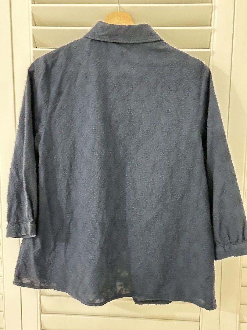 Blue Snowflake Pattern Button-Down Blouse (Category: Blouses) located in Singapore. Submitted by kindermum (Listing ID 1465699877, Image 2). Description: - Color & Pattern: Dark blue with all-over snowflake print - Material: Lightweight, semi-sheer fabric - Sleeves: Three-quarter length with button cuffs - Collar: Rounded in front, band collar on the reverse - 9/10 condition for this blue collar button up Blouse - Muji Top Condition: Includes a s