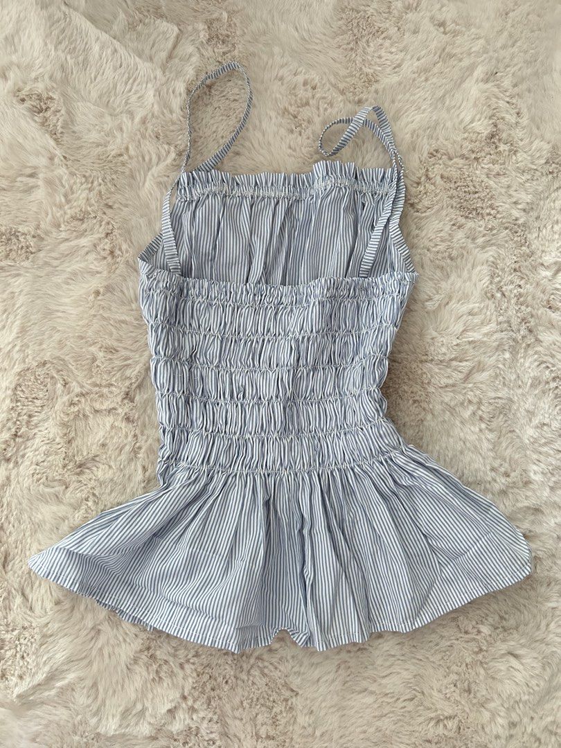 blue striped smocked cami top peplum (Category: Sleeveless) located in San Juan City. Submitted by ilovekitaro (Listing ID 1465587686, Image 2). Description: - stretchable ! - can fit xs-s - hardly worn RFS : not my style anymore mop : gcash only mod : lalamove, j&t, ggx loc : san juan city metro manila.