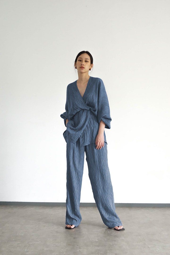 Blue Wrinkled Texture Matching Top and Pants Set (Category: Sets or Coordinates) located in Manila. Submitted by cheddarph (Listing ID 1465719556, Image 1). Description: - Color: Dusty Blue - Style: Versatile matching two-piece lounge set - Fabric: Crinkled textured material for all-day comfort - Top: Reversible design (deep V-neck on one side, crew neck on the other) with loose half sleeves and a relaxed fit - Bottoms: Features a comfortable ela