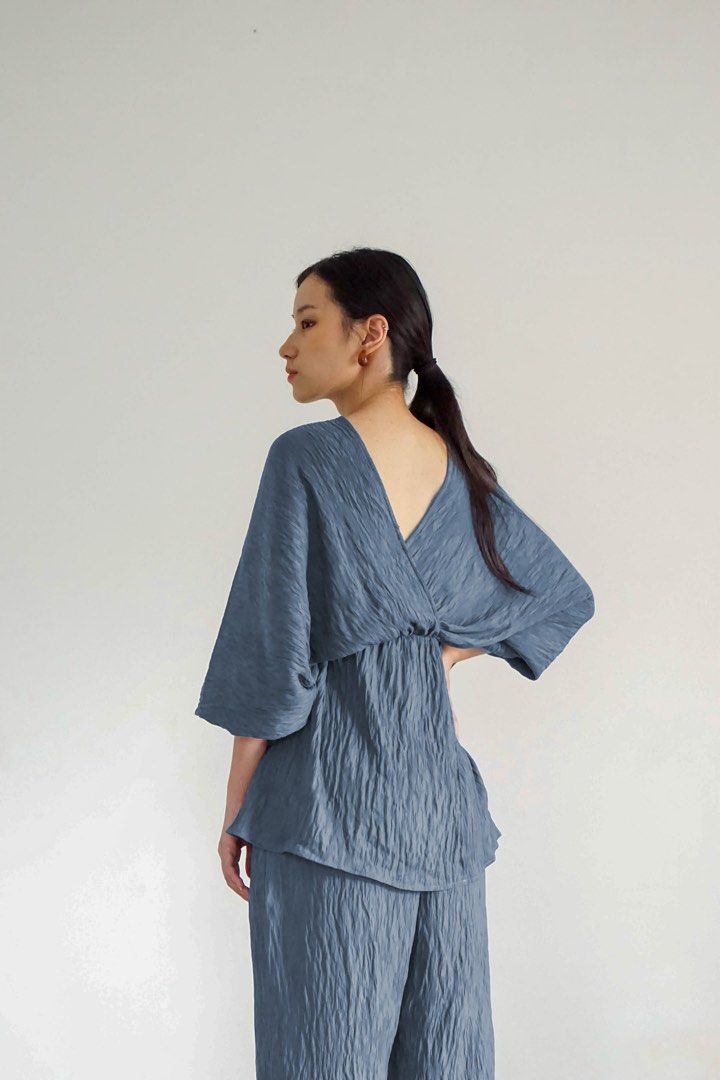 Blue Wrinkled Texture Matching Top and Pants Set (Category: Sets or Coordinates) located in Manila. Submitted by cheddarph (Listing ID 1465719556, Image 3). Description: - Color: Dusty Blue - Style: Versatile matching two-piece lounge set - Fabric: Crinkled textured material for all-day comfort - Top: Reversible design (deep V-neck on one side, crew neck on the other) with loose half sleeves and a relaxed fit - Bottoms: Features a comfortable ela
