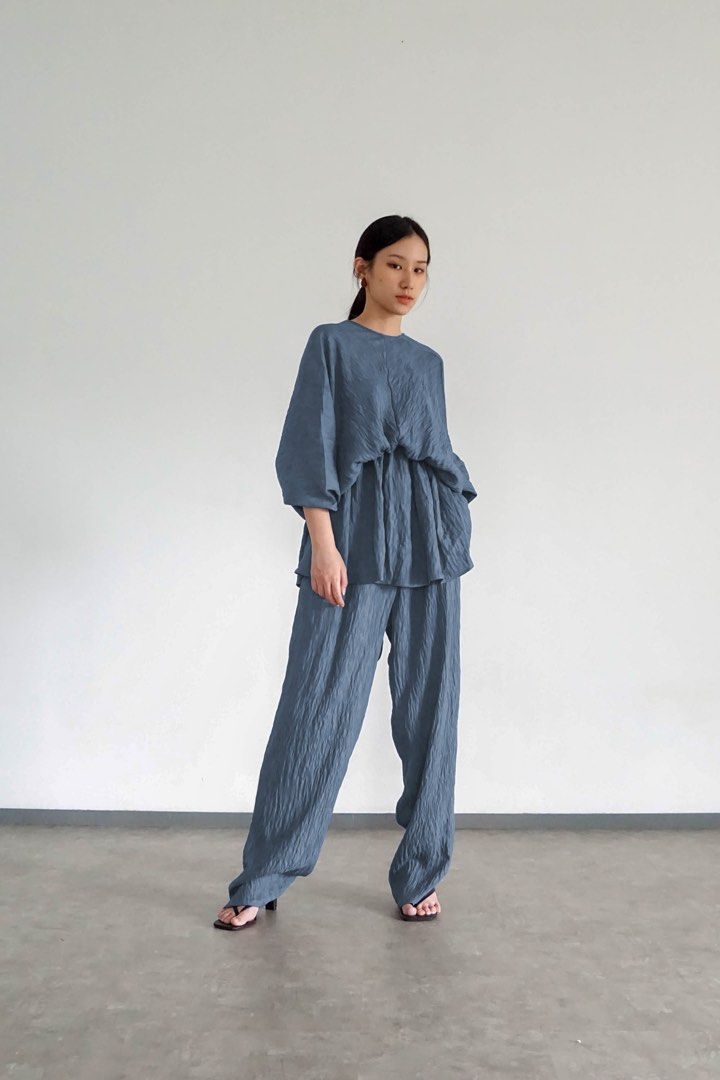 Blue Wrinkled Texture Matching Top and Pants Set (Category: Sets or Coordinates) located in Manila. Submitted by cheddarph (Listing ID 1465719556, Image 2). Description: - Color: Dusty Blue - Style: Versatile matching two-piece lounge set - Fabric: Crinkled textured material for all-day comfort - Top: Reversible design (deep V-neck on one side, crew neck on the other) with loose half sleeves and a relaxed fit - Bottoms: Features a comfortable ela