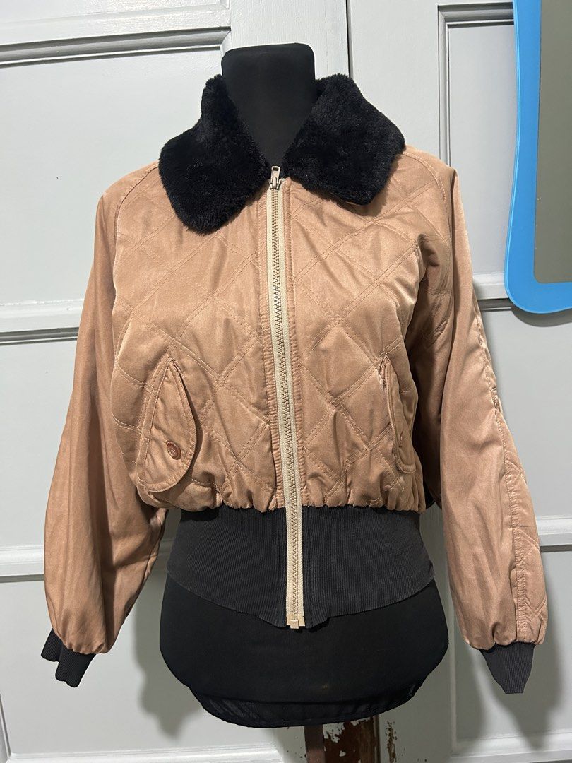 Bomber Jacket with Faux Fur Collar (Category: Coats, Jackets and Outerwear) located in Manila. Submitted by yuShin09 (Listing ID 1465629680, Image 2). Description: - Tan quilted suede bomber jacket with a short cropped fit can fit up to medium perfect for Travel - Well used the black parts are a bit dark gray - Contrast black faux fur collar can work as bomber jacket or winter jacket removable collar - Two front flap pockets secured with brown bu