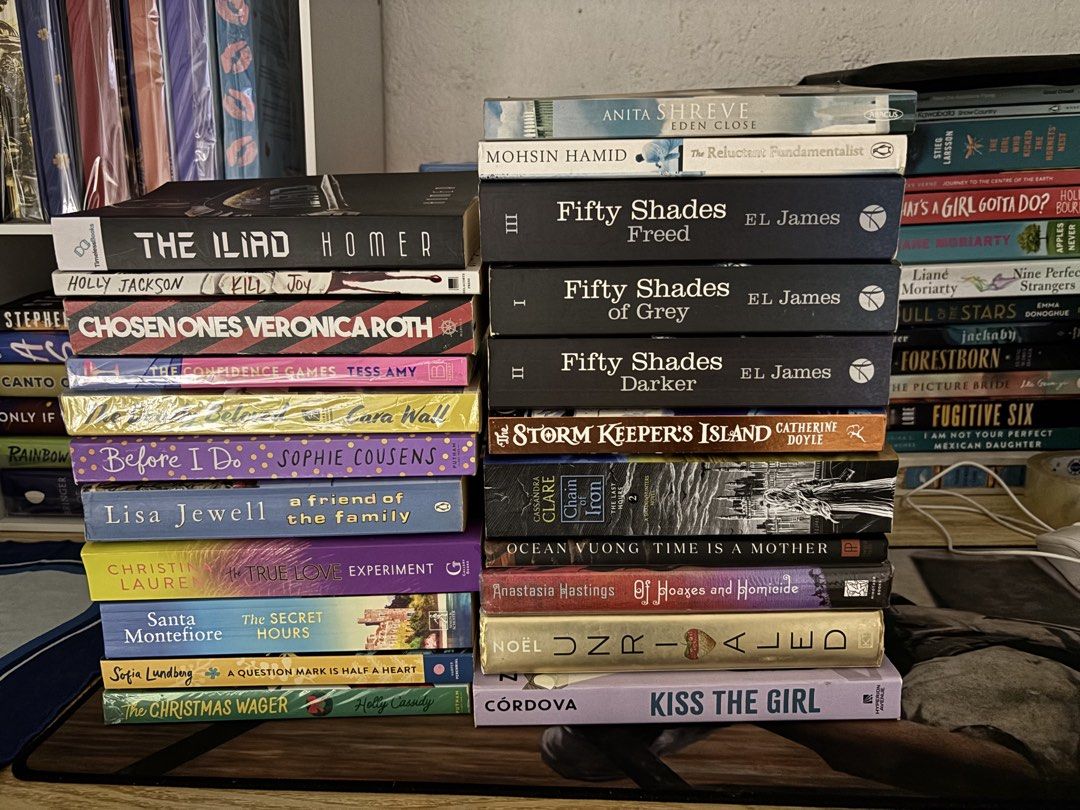 BOOKS FOR SALE (Category: Storybooks) located in Baguio. Submitted by kewlfinds (Listing ID 1465600268, Image 1). Description: - Genre: Mixed (Fiction, Classics, Romance, YA) - Featured Titles: Fifty Shades trilogy, The Iliad, Chosen Ones by Veronica Roth, and more - Condition: Varies from brand new with plastic wrap to read-once preloved - Options: Buy per piece or take the whole stack - Perfect for building up your reading list - Message for in