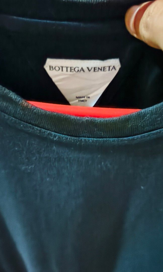 Bottega veneta plain black tee (Category: Luxury Apparel) located in Manila. Submitted by mackussil (Listing ID 1465678099, Image 2). Description: like new. no issue color rate 9/10 condition 10/10 maliwanag lng po ilaw kaya medyo faded tignan.