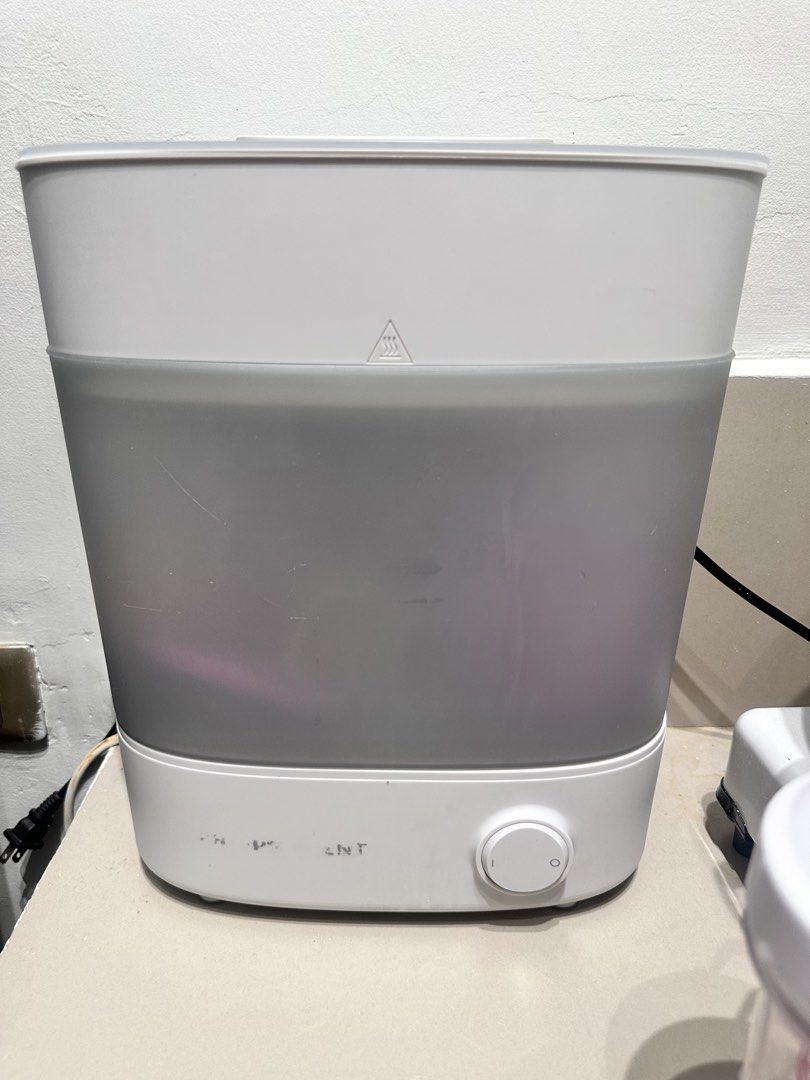 Bottle Sterilizer with DJ Scorpio AC Transformer Bundle (Category: Breastfeeding & Bottle Feeding) located in Pasig City. Submitted by cassydeclutter (Listing ID 1465626146, Image 1). Description: - White and grey electric bottle sterilizer bundle - Includes DJ Scorpio TC-1000 AC step-down transformer (220V to 110V, up to 1000W capacity) - Ideal for running imported 110V appliances in the Philippines - Shows normal signs of previous handling and 