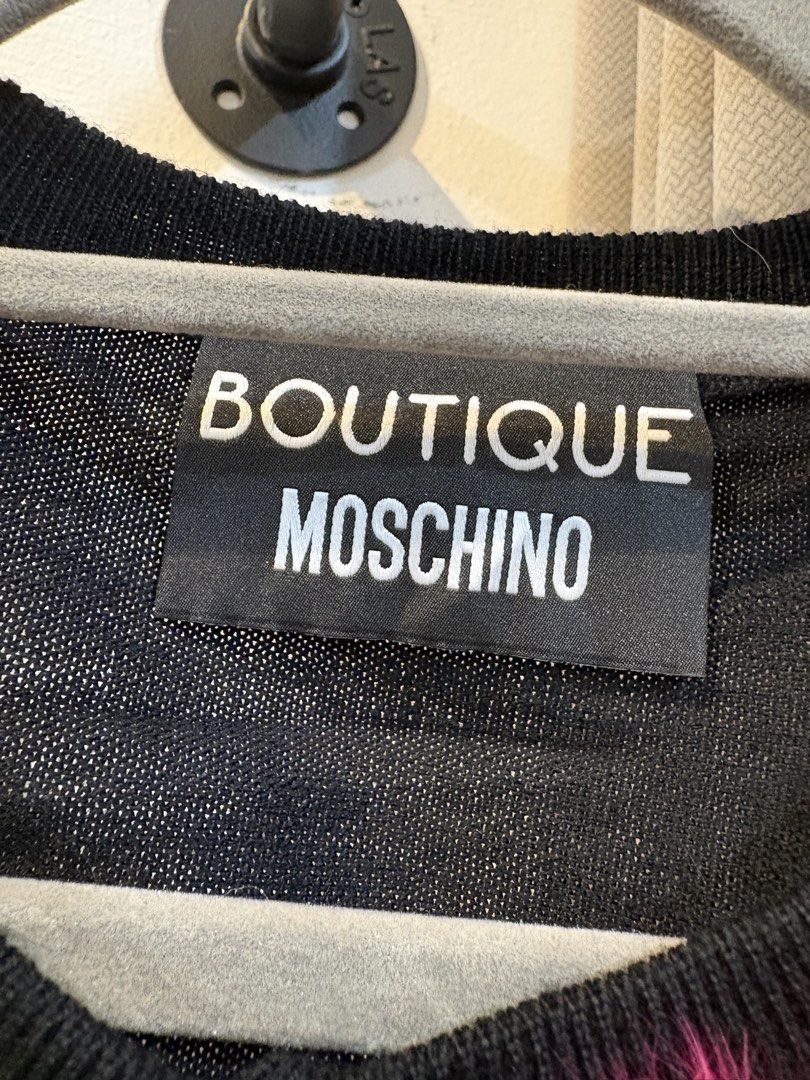 Boutiue Moschino Cardigan (Category: Coats, Jackets and Outerwear) located in Echague. Submitted by jake_rc (Listing ID 1465669578, Image 3). Description: Boutique Moschino features playful, fuzzy faux-fur flower appliqués in bright shades of green, hot pink, and orange near the neckline. Size France 40 Dimensions width 19 x length 19 Excellent condition No issue Price 650 plus SF.