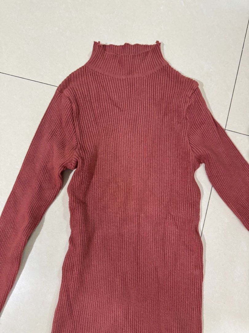 Brick red ribbed turtleneck long sleeve sweater (Category: Longsleeves) located in Quezon City. Submitted by sweetlyluxe (Listing ID 1465601937, Image 2). Description: - Color: Brick red, terracotta - Style: Turtleneck sweater with long sleeves and a fitted silhouette - Texture: Soft and stretchy ribbed knit - Condition: Worn a few times, no tags attached - Versatility: Great for layering under jackets or wearing on its own.