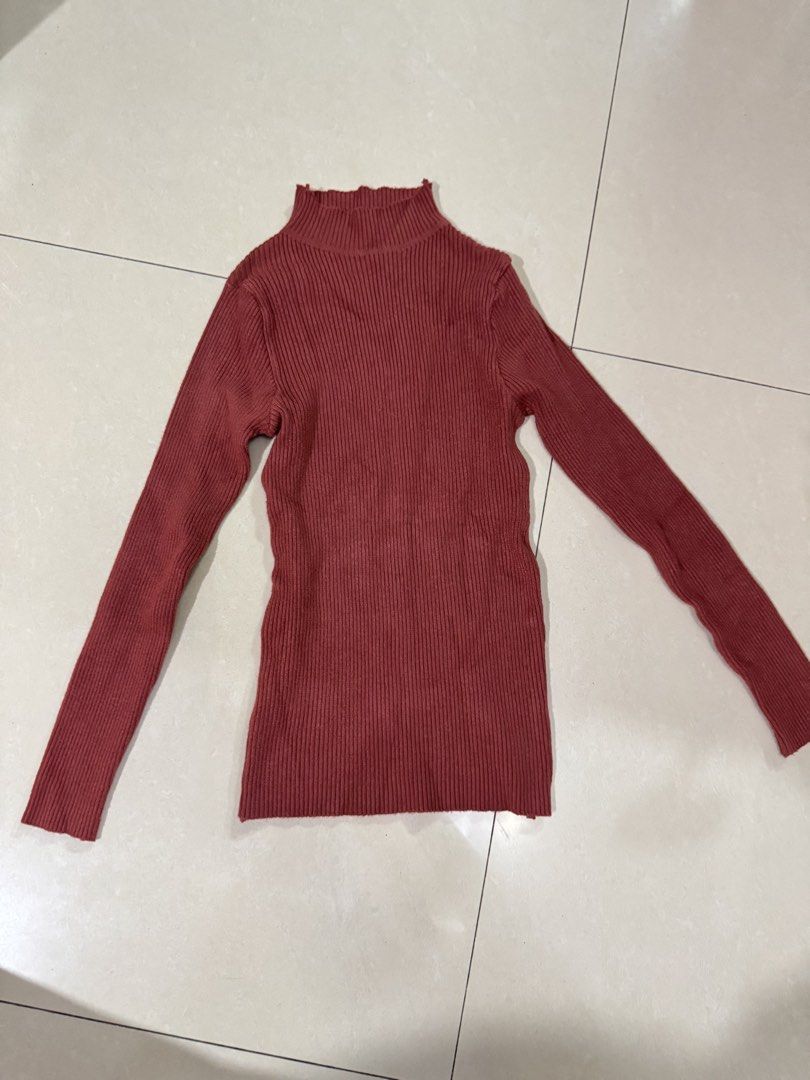 Brick red ribbed turtleneck long sleeve sweater (Category: Longsleeves) located in Quezon City. Submitted by sweetlyluxe (Listing ID 1465601937, Image 1). Description: - Color: Brick red, terracotta - Style: Turtleneck sweater with long sleeves and a fitted silhouette - Texture: Soft and stretchy ribbed knit - Condition: Worn a few times, no tags attached - Versatility: Great for layering under jackets or wearing on its own.