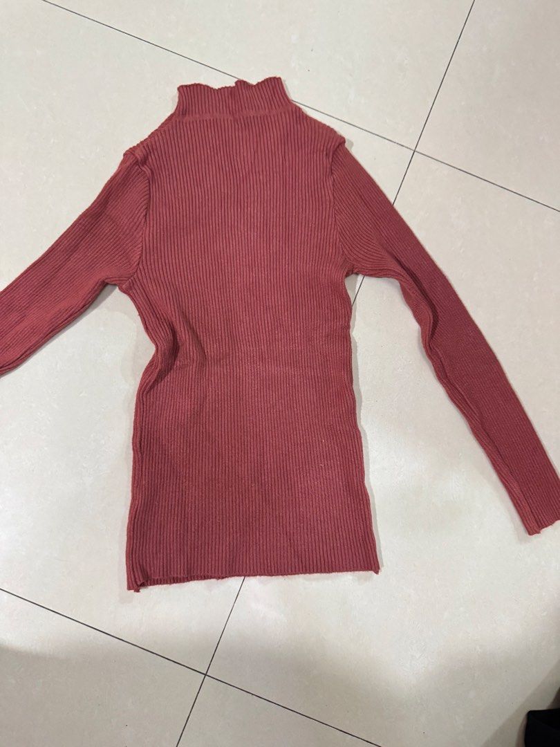 Brick red ribbed turtleneck long sleeve sweater (Category: Longsleeves) located in Quezon City. Submitted by sweetlyluxe (Listing ID 1465601937, Image 3). Description: - Color: Brick red, terracotta - Style: Turtleneck sweater with long sleeves and a fitted silhouette - Texture: Soft and stretchy ribbed knit - Condition: Worn a few times, no tags attached - Versatility: Great for layering under jackets or wearing on its own.