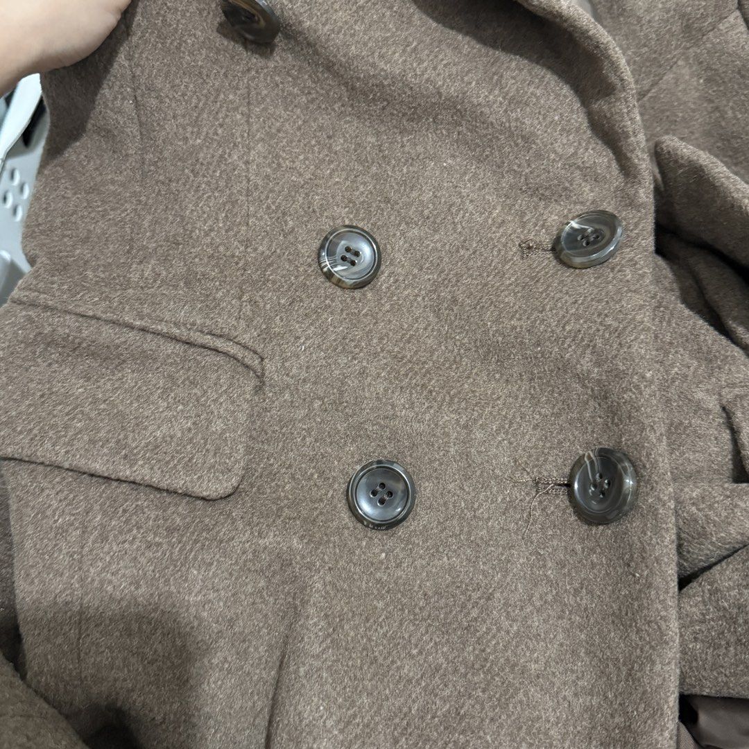 Brown Double Breasted Wool Coat Jacket (Category: Coats, Jackets and Outerwear) located in Makati City. Submitted by julyco. (Listing ID 1465440235, Image 3). Description: - Brand: Style 2 One - Color: Brown - Style: Double-breasted coat with notch lapel and front button closure - Features: Structured shoulders, long sleeves, flap hip pockets, fully lined interior - Material/Fit: Heavy textured fabric, mid-length cut - Condition/Vibe: Clean look,