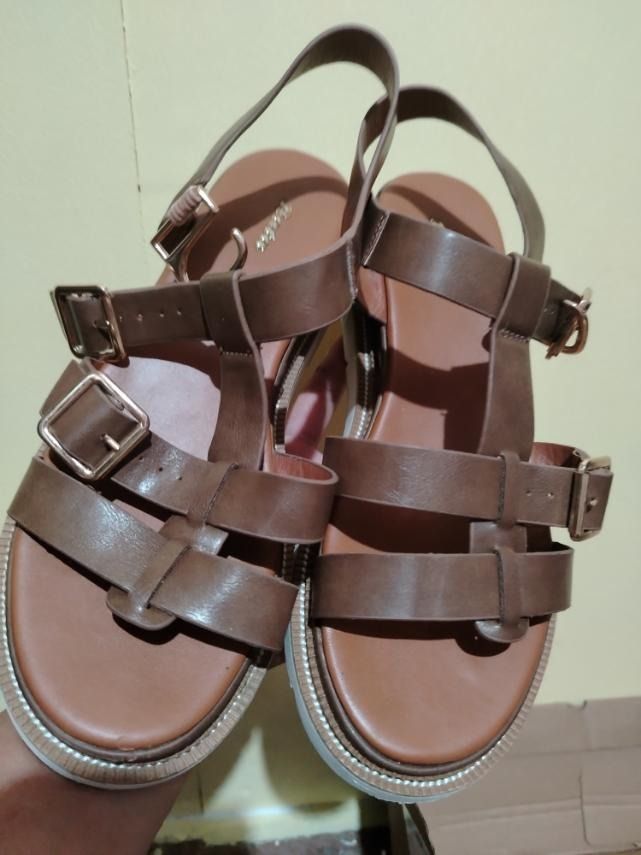 Brown Platform Sandals with Buckles and White Sole (Category: Flats & Sandals) located in Caloocan City. Submitted by marco.antor (Listing ID 1465687646, Image 3). Description: - Brown strappy platform sandals with a classic gladiator-inspired design - Features eye-catching gold-tone buckle details on multiple straps - Comfortable block platform heel ideal for daily wear and casual outings - Durable white rubber outsoles for better grip - Comes c