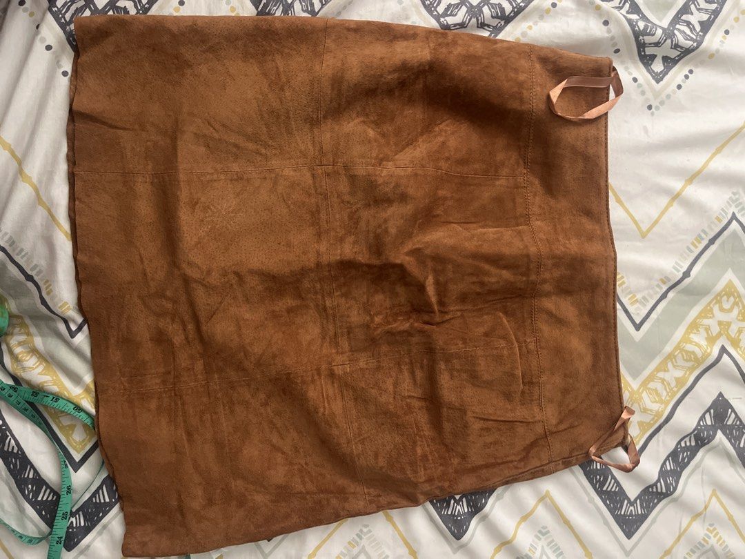 Brown Suede Button Front Skirt (Category: Skirts) located in Pasig City. Submitted by jnzmrq1003 (Listing ID 1465604585, Image 3). Description: - Brand: Patrizia Dini - Material: Brown faux suede (fully lined) - Size: EUR 38 / UK 12 - Measurements (flat lay): Waist ~16 inches, Length ~21 inches - Details: Front button closure, gold-tone hardware, two front patch pockets - Condition: Clean inside and out, excellent pre-loved condition - Style Tip: