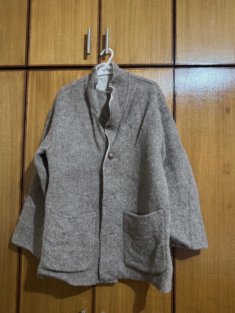 Brown Wool Blend Jacket with Front Pockets (Category: Coats, Jackets and Outerwear) located in Santa Cruz, Pampanga. Submitted by eygee_rp (Listing ID 1465725444, Image 1). Description: - Brown woolen outerwear with a stylish textured finish - Features a cozy stand-up collar and long sleeves - Single brown button fastening with lower accent buttonholes - Equipped with two large, practical patch pockets on both sides - Warm, comfortable fit ideal 