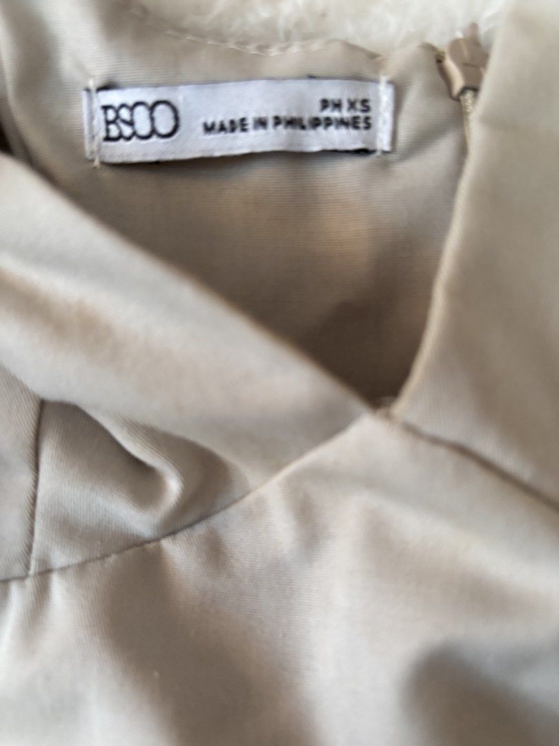 BSCO Beige Peplum Tie-Strap Top Size XS (Category: Sleeveless) located in Quezon City. Submitted by hadescloset (Listing ID 1465656499, Image 2). Description: - Can negotiate the price 🛒 shop more to get more discounts and freebies! - Brand: BSCO - Size: XS - Color: Beige - Material: Structured woven fabric with diagonal twill texture - Design: Tie-ribbon shoulder straps, deep v-neckline, and flared peplum waist hem - Closure: Back zipper - Orig