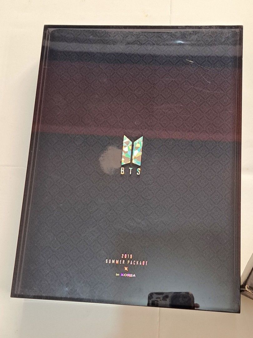 BTS 2019 Summer Package in Korea (Category: K-Wave Merchandise) located in Manila. Submitted by yselles__ (Listing ID 1465600769, Image 1). Description: - Official BTS 2019 Summer Package in Korea box set - Includes outer box, photobook, fan, and drawing diary - Comes with RM photocard (sealed in plastic) - All items pictured are included in the bundle - 100% official K-pop merchandise, great for collectors.