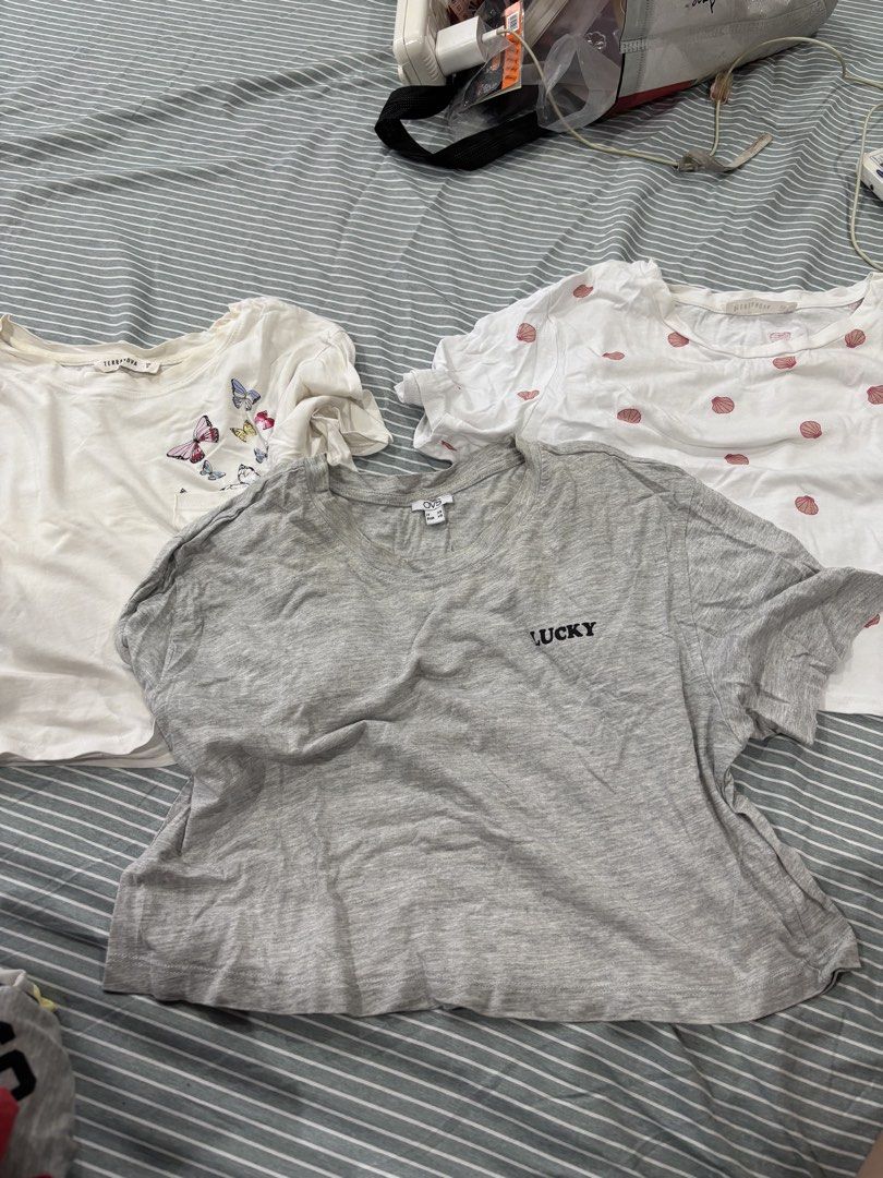 Bundle of 3 Cropped Shirts (Category: Shirts) located in San Pablo. Submitted by loved.goods0501 (Listing ID 1465648798, Image 1). Description: Bundle of 3 casual short-sleeve t-shirts Grey crop top (XS) White shirt with butterfly (S) White shirt with seashell (XS).