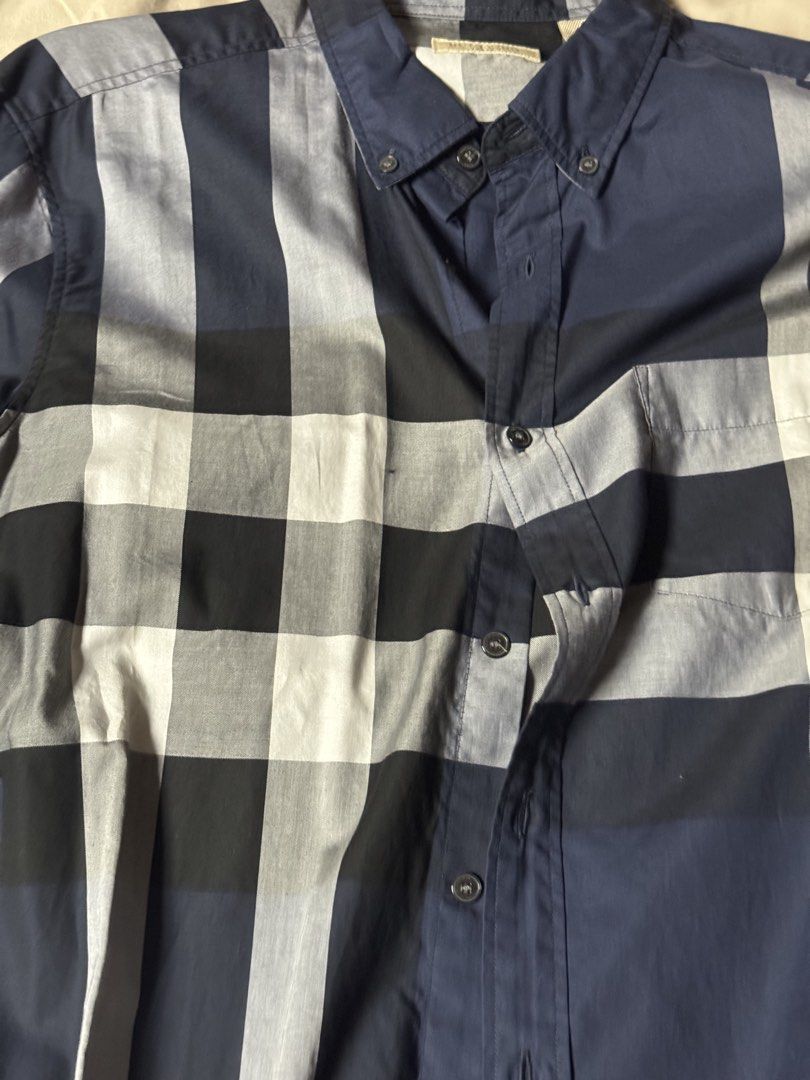 Burberry Blue Plaid Button Down Shirt Long Sleeve (Category: Longsleeves) located in Manila. Submitted by seangoart (Listing ID 1465734905, Image 3). Description: - Brand: Burberry - Pattern: Classic check (Navy Blue, White, Grey) - Style: Long-sleeve button-down with front chest pocket and collar buttons - Material: Premium quality cotton - Fit: Standard sizing - Condition: Clean, excellent, and ready to wear - Perfect for smart casual and corpo