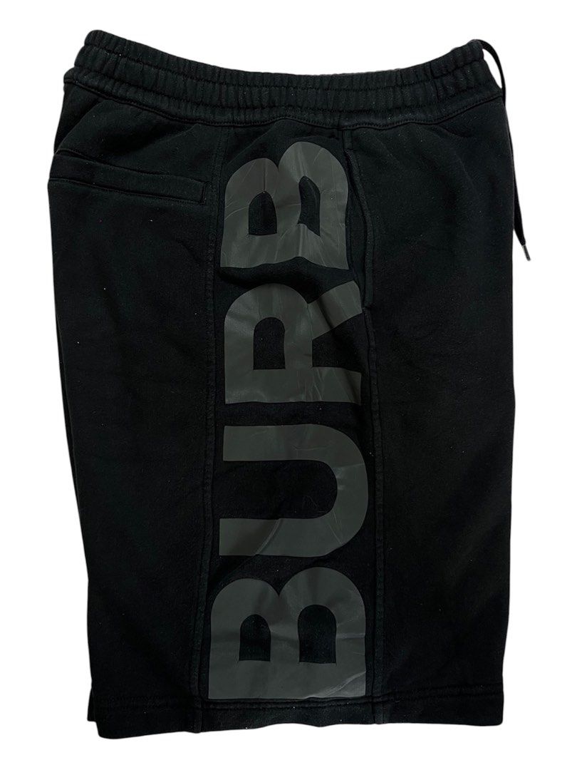 Burberry Sweatshorts (Category: Shorts) located in Baguio. Submitted by drwxrms (Listing ID 1465616892, Image 2). Description: Burberry Sweatshorts Spell out logo in reflective 3m print Excellent condition Issue* minimal crack print Small oversized 28-34x23.